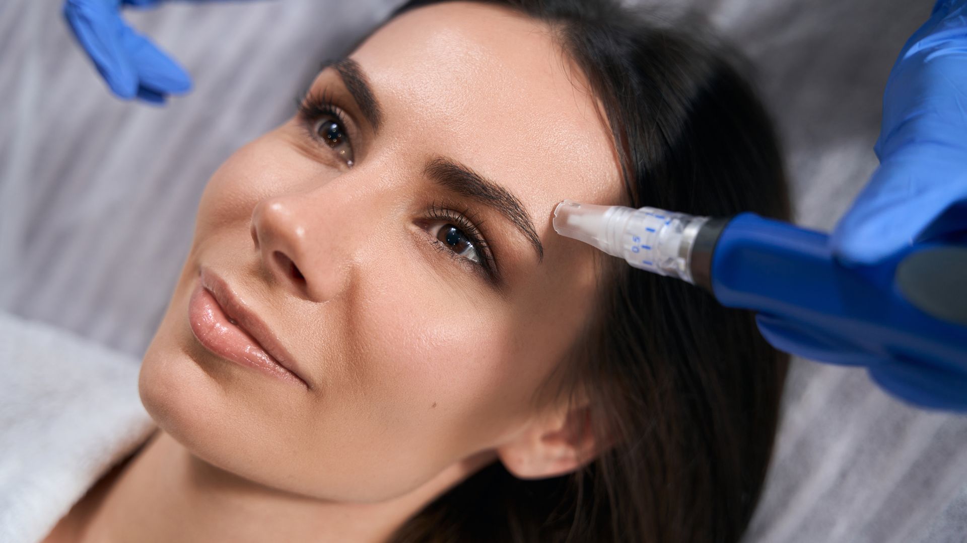 A woman getting botilage injections on her face