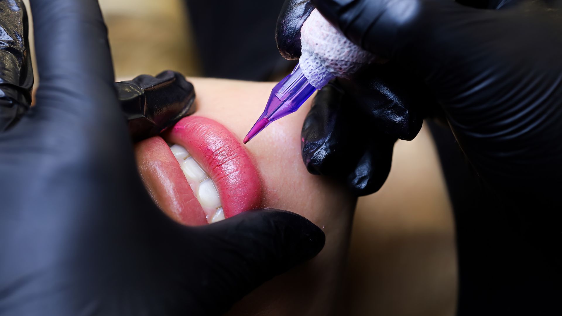 A close up of a person getting their lips painted